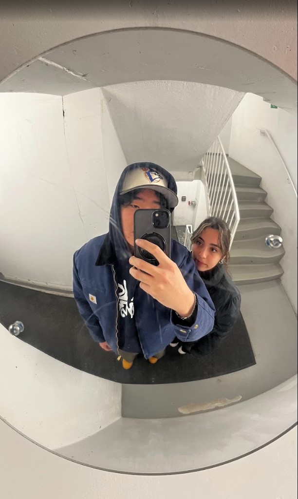 fisheye mirror selfie in a stairwell