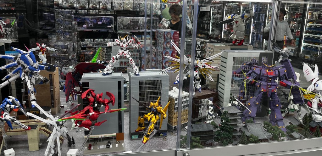 gundam model kits in a display case