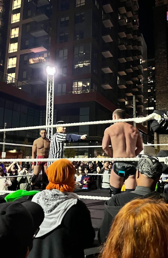 an outdoor wrestling match at night