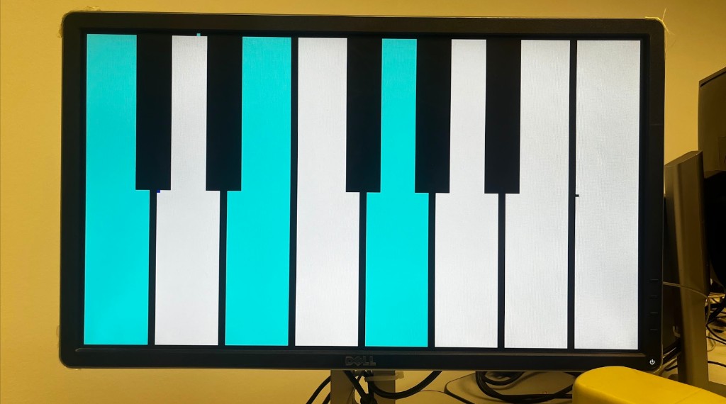 Piano keys rendered on a VGA display with several keys highlighted in cyan